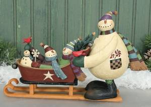 Snowman pushing sled williraye